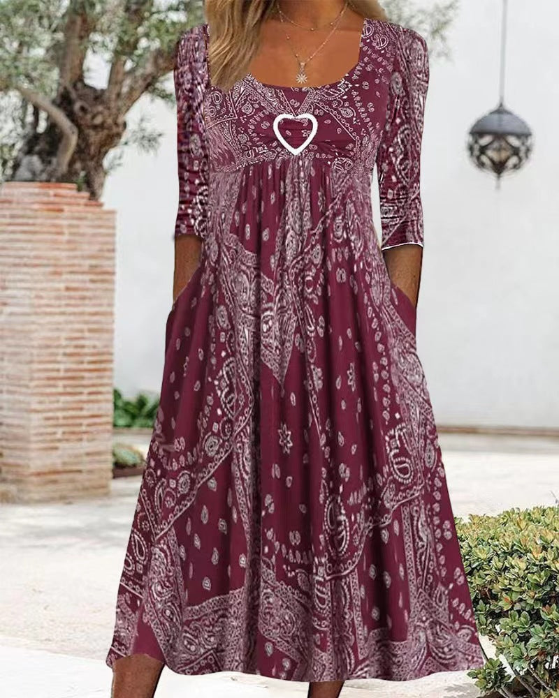 Women's maxi dress with paisley bandana pattern, empire seam, gathered underbust area, and side pockets Mune Fashion