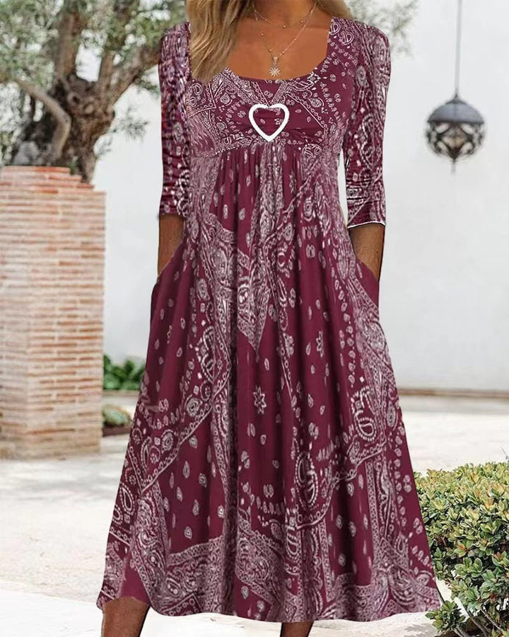 Women's maxi dress with paisley bandana pattern, empire seam, gathered underbust area, and side pockets Mune Fashion