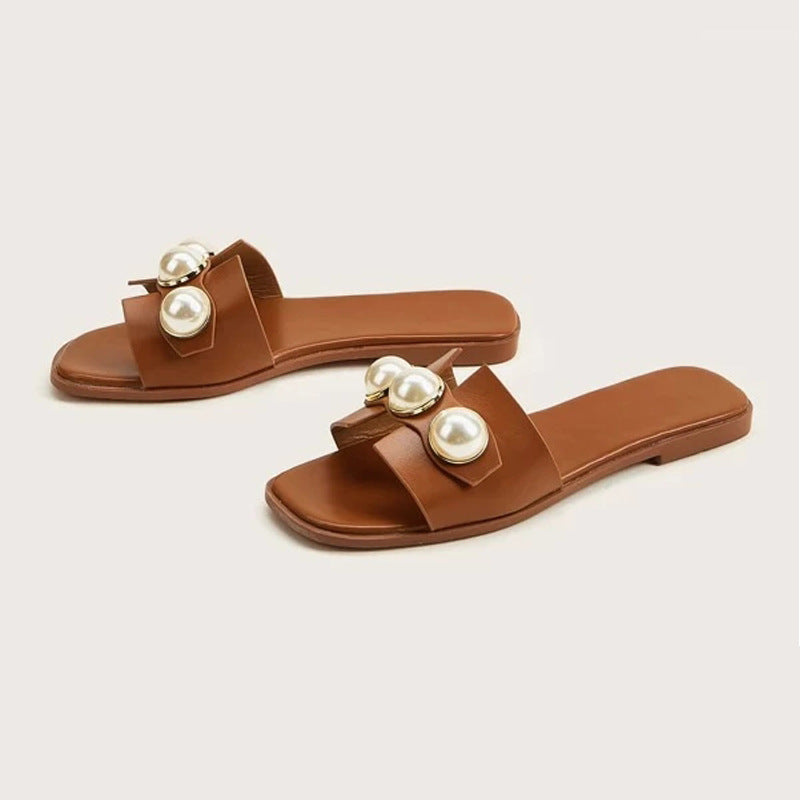Ladies' flat slide sandal with large decorative pearls and gold-trimmed applications padded comfort footbed Mune Fashion