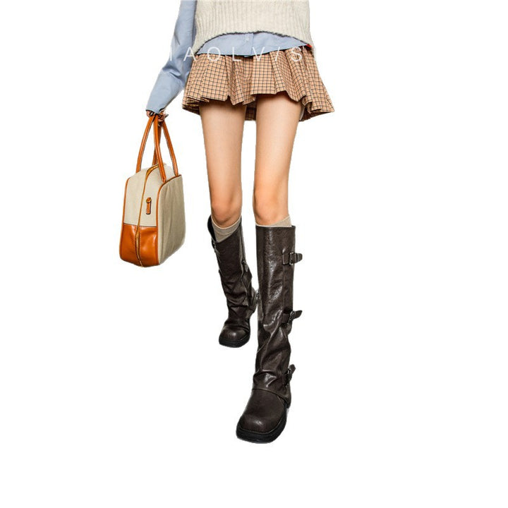 Women's knee-high slouch boots made of synthetic leather with adjustable buckles and textured platform heel Mune Fashion