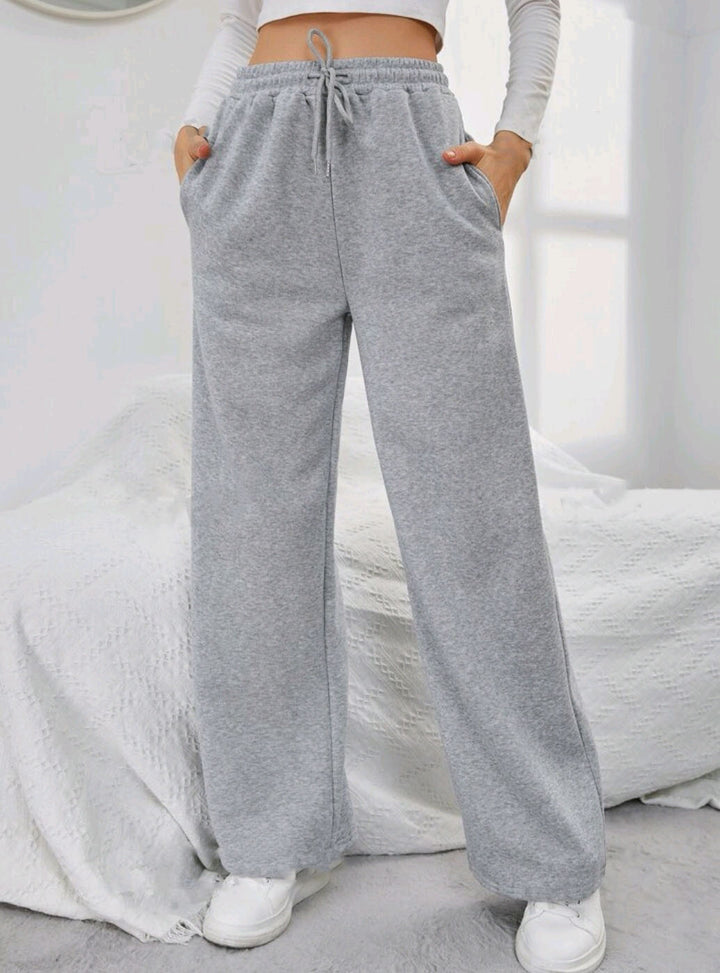 Women's High-Waist Wide-Leg Jogging Pants with elastic comfort waistband, drawstring, and deep side pockets Mune Fashion