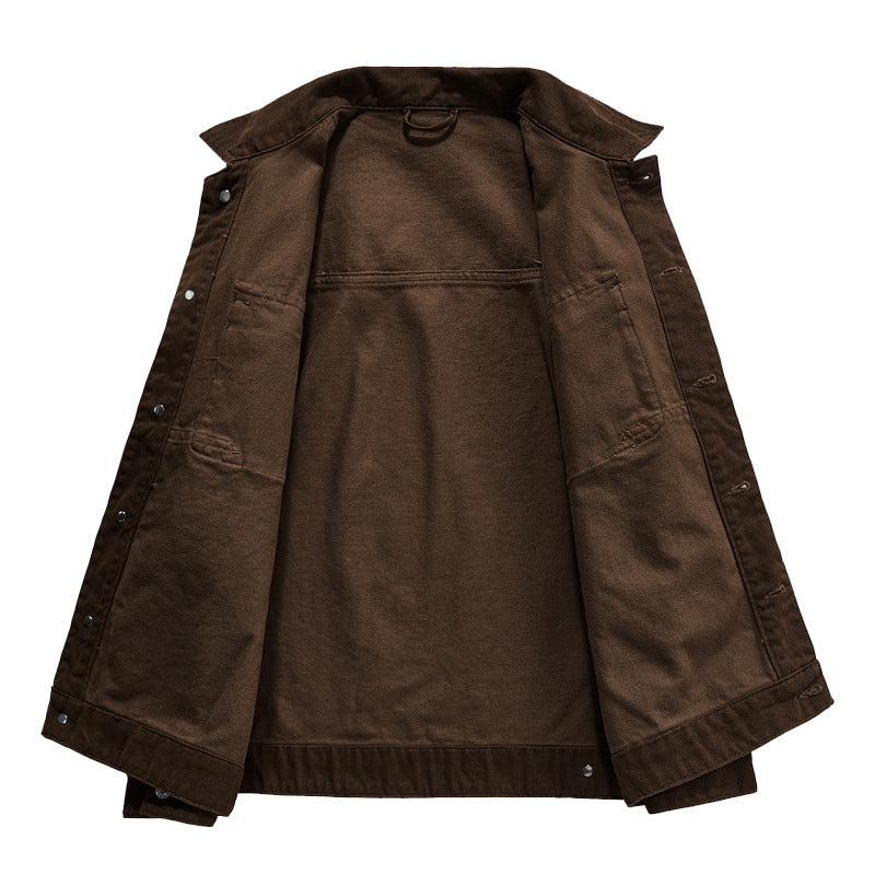 Men's short worker jacket made of heavy twill with applied flap pockets, slanted side pockets, and reinforced seams.