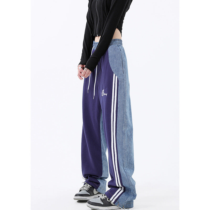 Ladies loose-fitting jogging pants with denim inserts, elastic waistband, and side contrast stripes Mune Fashion