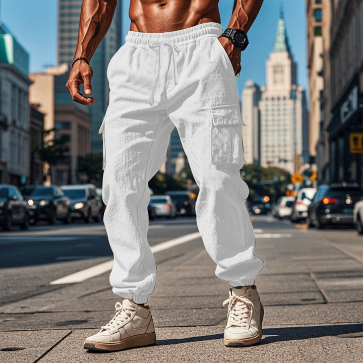 Men's sporty work-inspired joggers with patch flap pockets, elastic drawstring waistband, and gathered leg cuffs Mune Fashion
