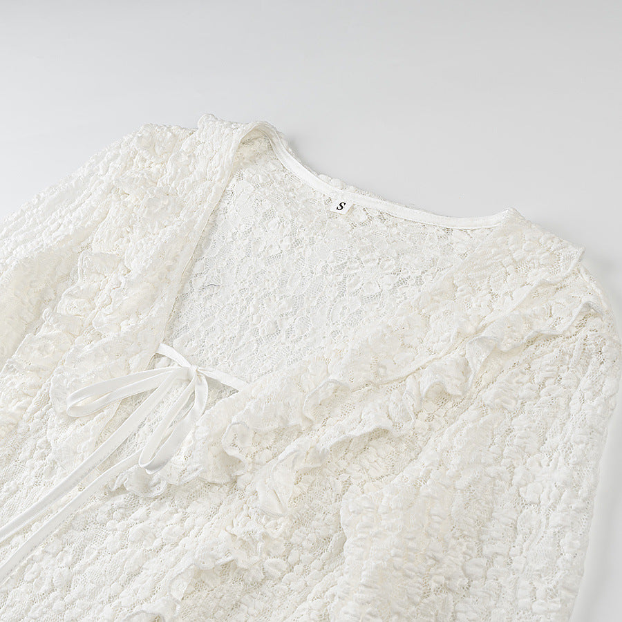 Ladies figure-hugging lace blouse with ruffle V-neck and tie detail Mune Fashion