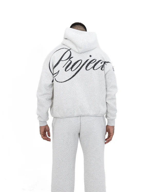 Men's wide comfort trousers with straight leg, elastic drawstring waistband, subtle logo embroidery, and fine speckled look Mune Fashion