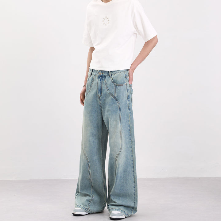 Men's wide-cut denim palazzo pants with curved seam panels and extra-long hem Mune Fashion