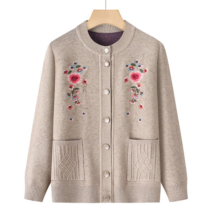 Women's embroidered cardigan with round neckline, decorative button placket, and patch pockets Mune Fashion