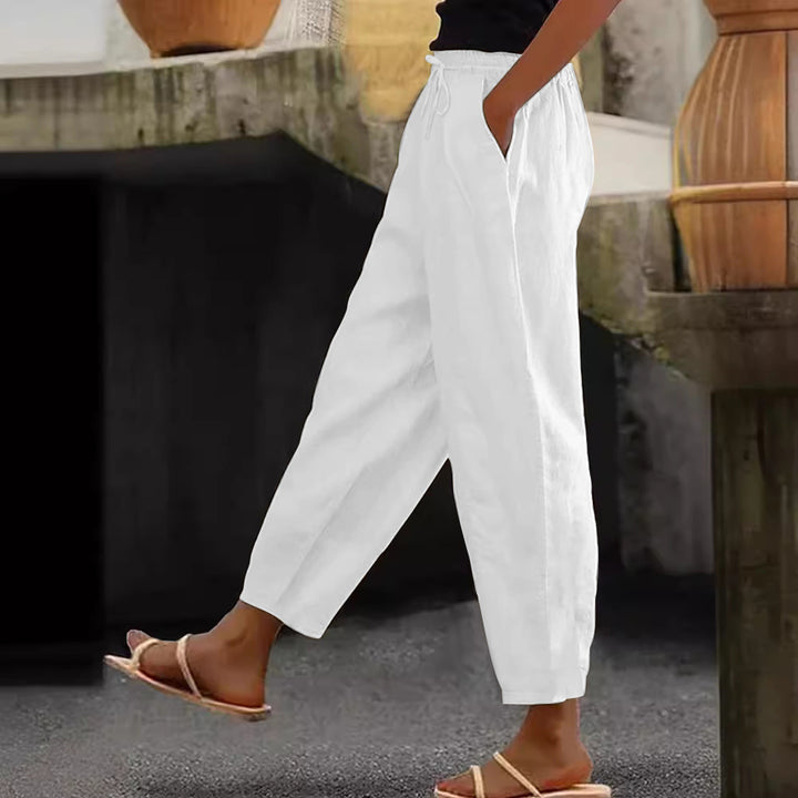 Women's loose-fitting linen blend pants with elastic waistband, drawstring, and angled side pockets Mune Fashion