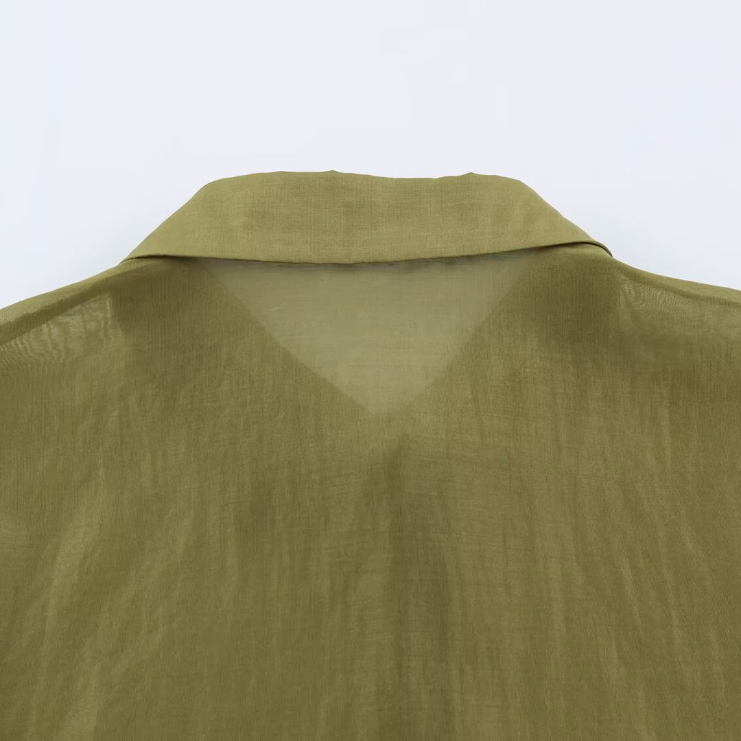 Women's silk effect blouse with voluminous sleeves, layered ruffles, and smocked cuffs
