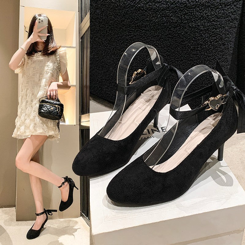 Women's velvet-look pumps with satin ankle straps, heart clasp, and slim stiletto heel
