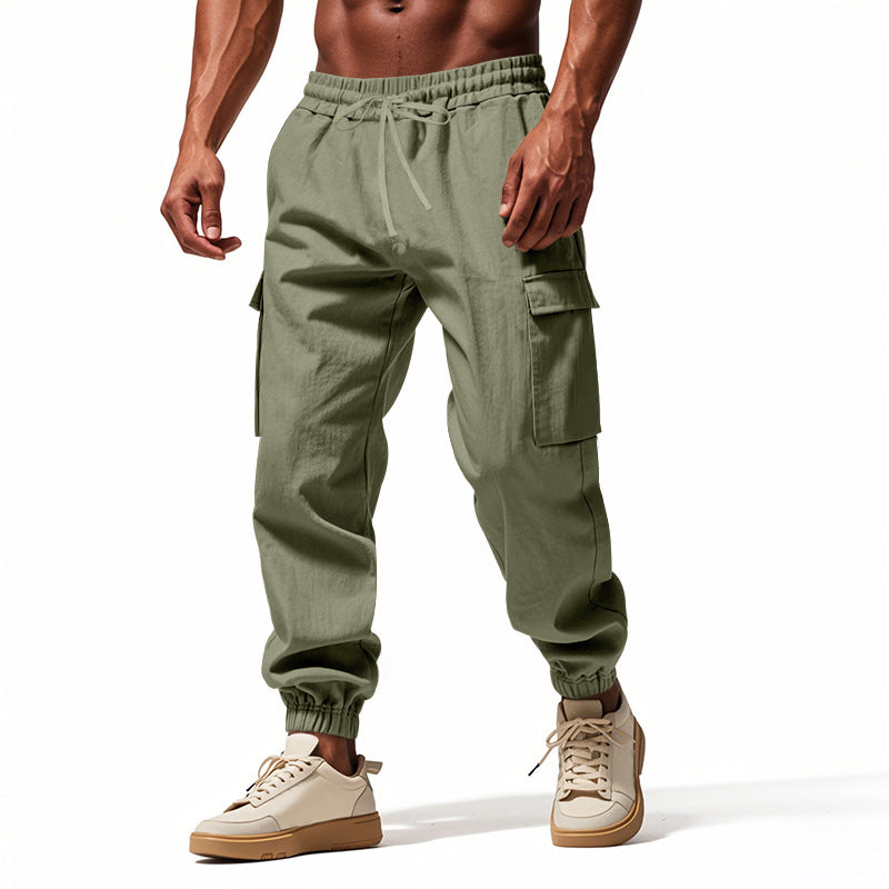 Men's tapered joggers in utilitarian style with elastic waistband, drawstring, and flap pockets Mune Fashion