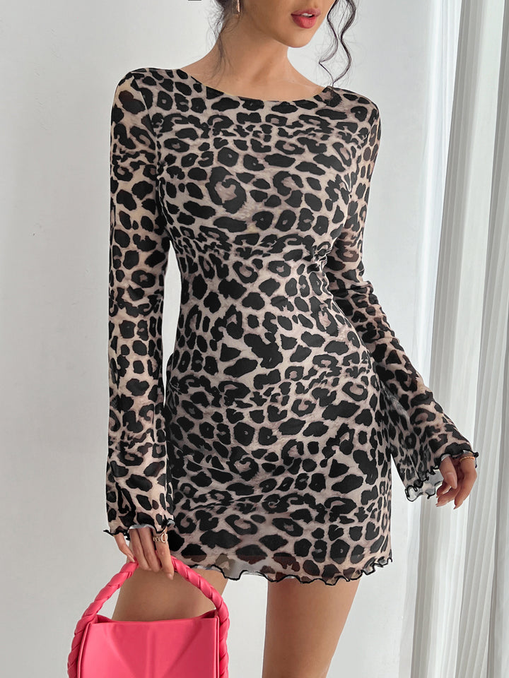 Women's form-fitting transparent mesh mini dress with leopard print, boat neckline, and wavy hem Mune Fashion