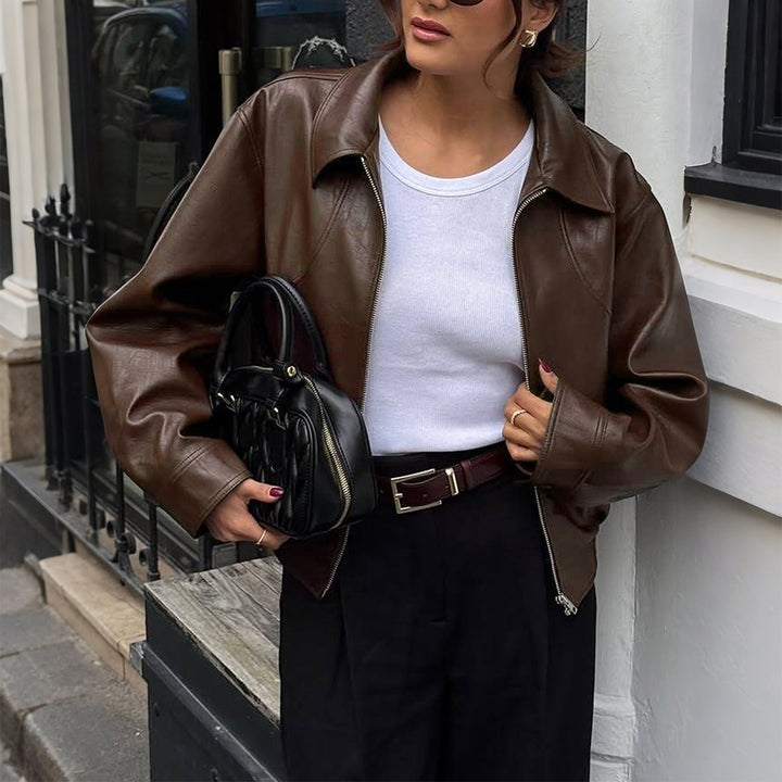 Women's short oversized leather jacket with shirt collar, visible zipper, and casual silhouette Mune Fashion