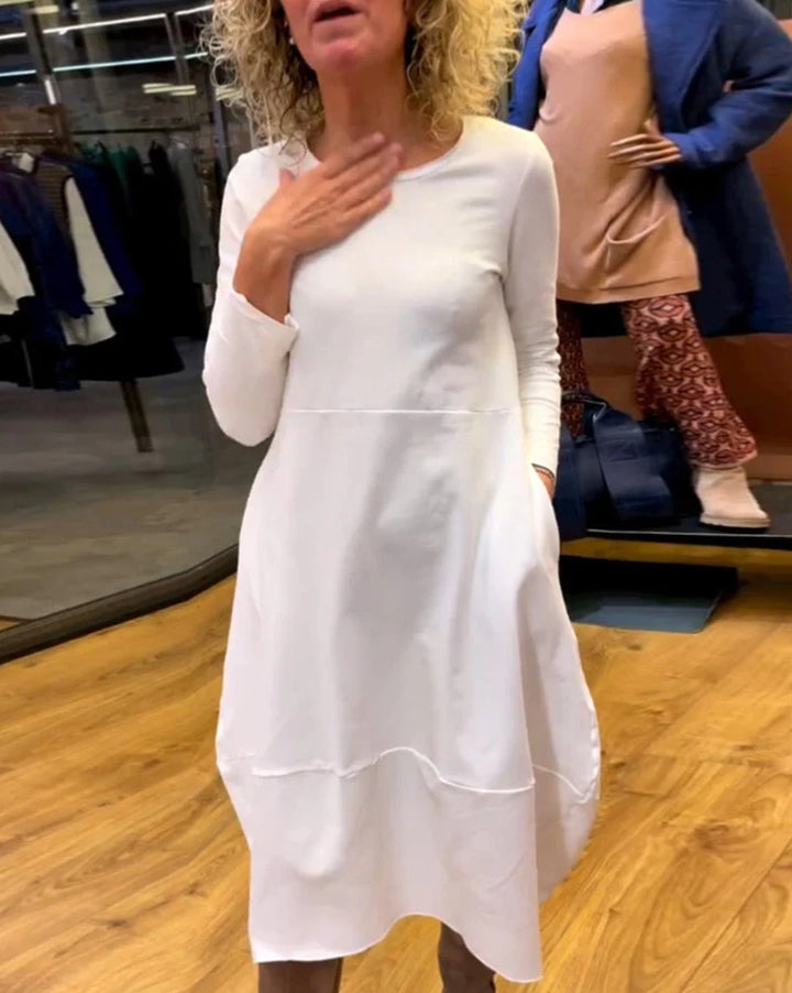 Women's asymmetrical balloon dress with three-quarter sleeves, side pockets, and flowing pointed hem Mune Fashion
