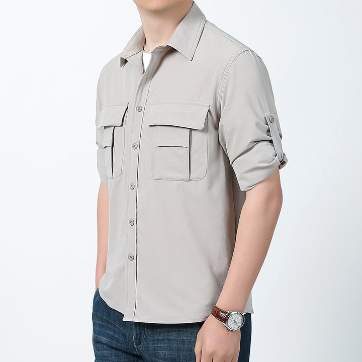 Men's lightweight field shirt with concealed button placket, two patch breast pockets and roll-up sleeves.