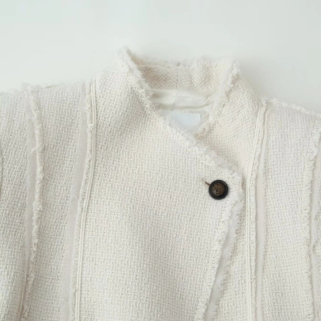 Ladies tailored bouclé jacket with stand-up collar, decorative strap, and subtle fringes Mune Fashion