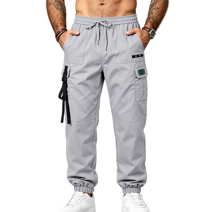 Men's utility cargo pants in jogger style with elastic waistband, multiple pockets and leg straps Mune Fashion