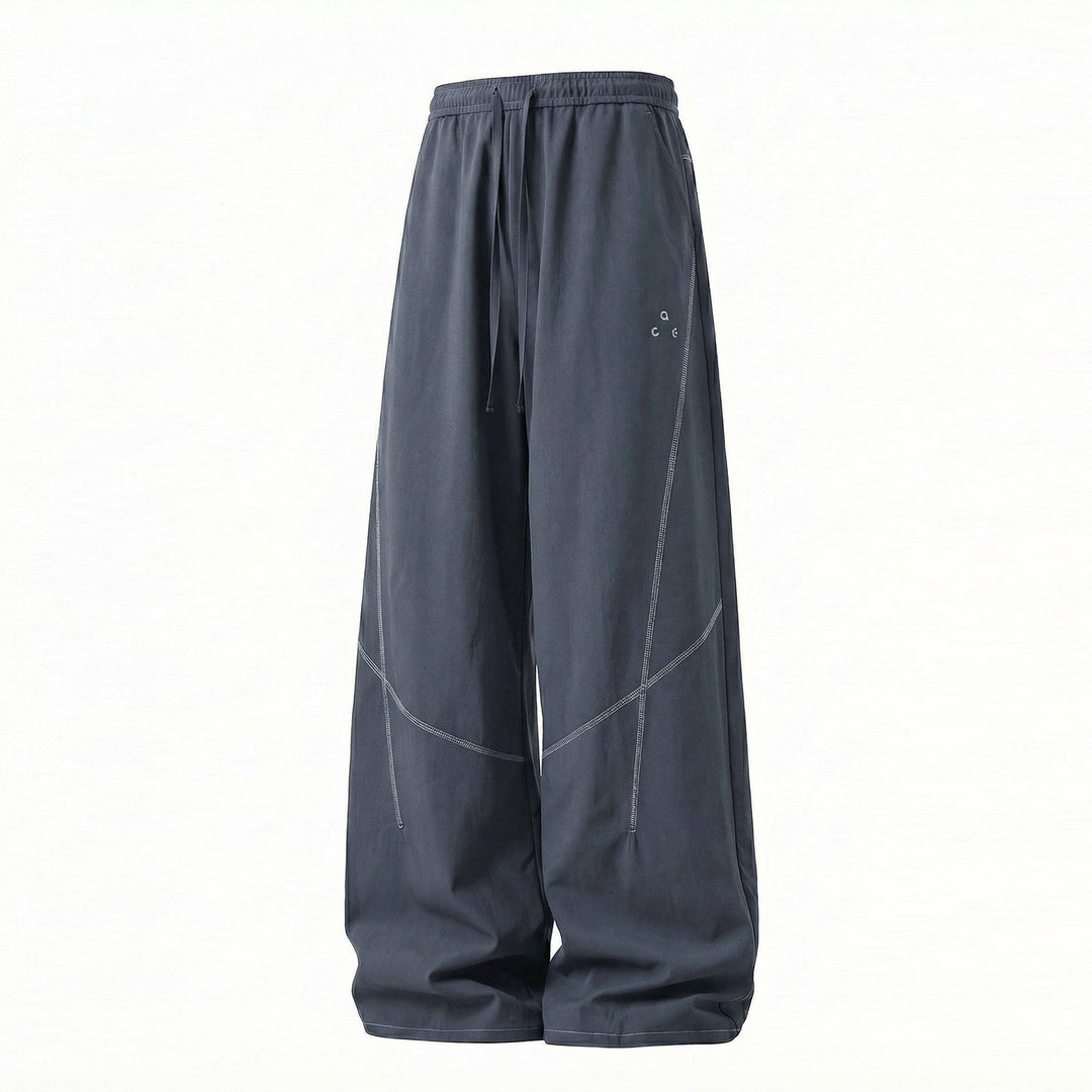 Unisex Extra wide training pants in palazzo cut with drawstring and striking decorative seams Mune Fashion