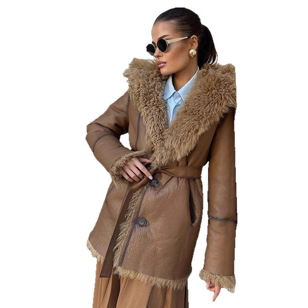 Women’s short coat made of voluminous bouclé faux fur with wrap and waist belt Mune Fashion