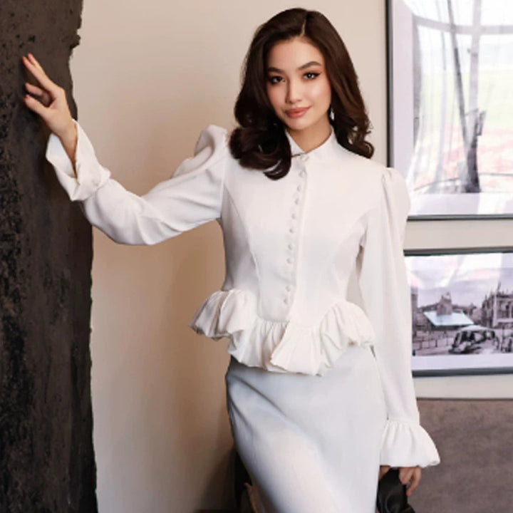 Ladies tailored peplum blouse with stand-up collar, covered button placket and puff sleeves Mune Fashion