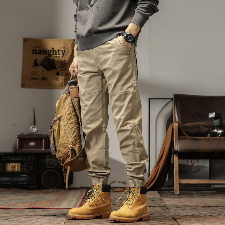 Men's tapered cargo pants in jogger style with knee seam details, drawstring & elastic cuffs