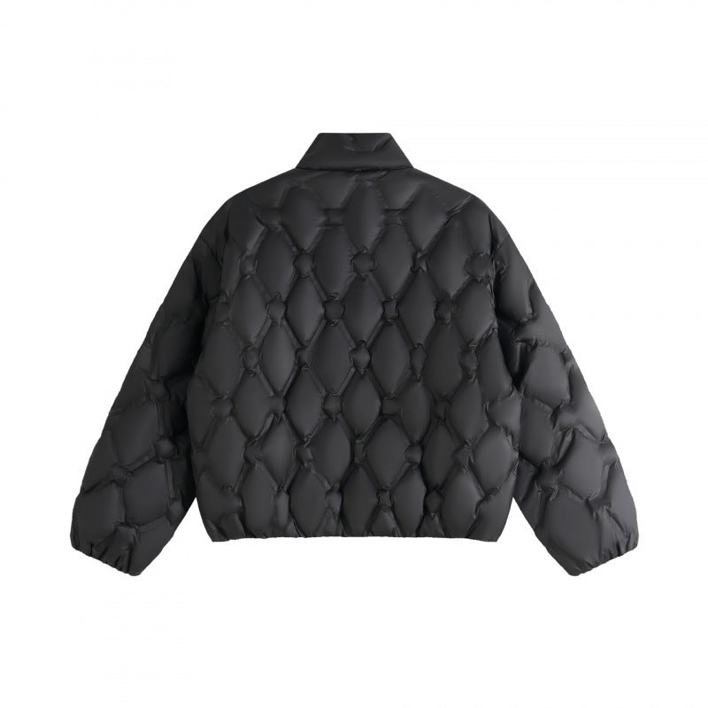 Unisex short cut quilted jacket in boxy cut with diamond quilting and diagonal zip pockets Mune Fashion