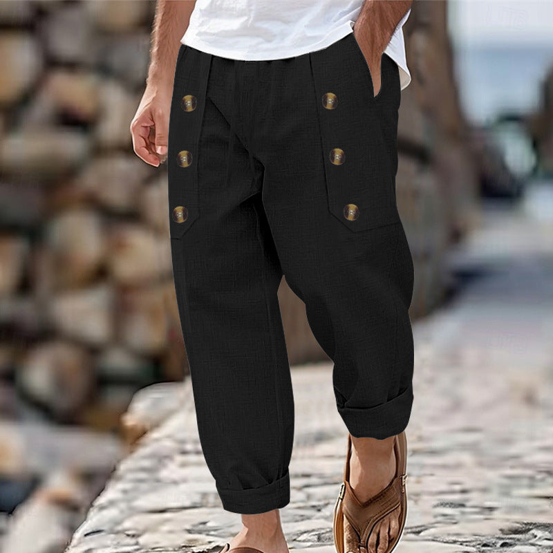 Men's loose linen trousers with decorative button stripes, rolled ankle cuffs, and side pockets Mune Fashion