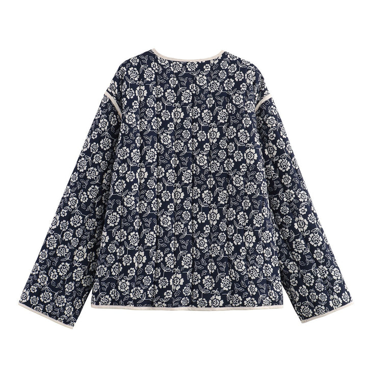 Ladies quilted jacket with floral allover, V-neck, contrast piping and patch pockets Mune Fashion