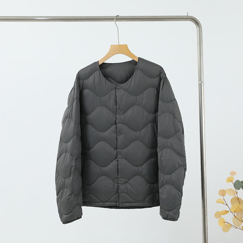 Women’s sleeveless thermal quilted vest with wave-shaped quilting and snap button closure Mune Fashion