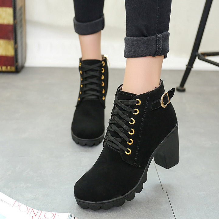 Women's elegant lace-up ankle boots with mid-block heel, grooved rubber sole, and decorative metal buckle Mune Fashion