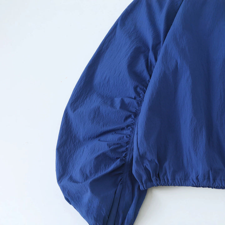 Women's Light Cropped Transition Jacket with Stand-Up Collar, Wide Raglan Sleeves and Drawstring Mune Fashion