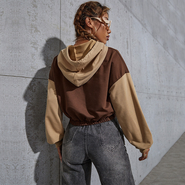 Ladies short cut cropped hoodie with color block sleeves, drawstring and elastic hem Mune Fashion