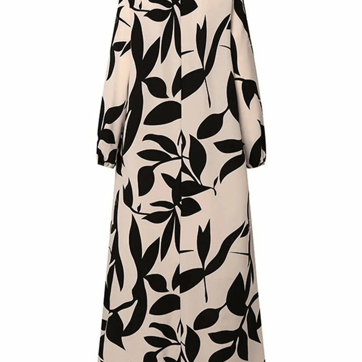 Women's maxi dress with loose A-line cut, flowing fit and eye-catching leaf print Mune Fashion