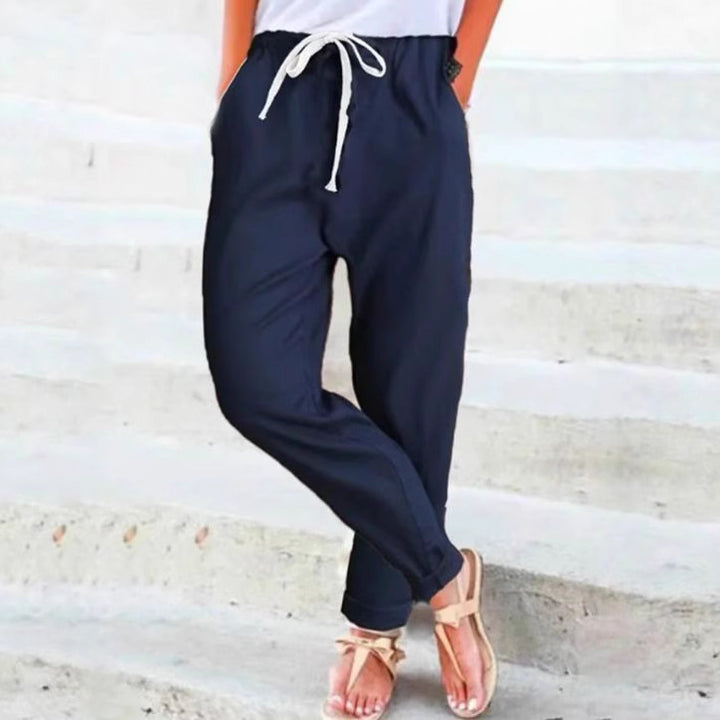 Women's light linen blend pants with elastic waistband, drawstring, and tapered ankle section Mune Fashion
