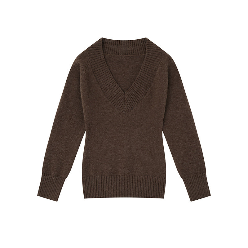 Women's fine knit pullover with deep V-neck, wide ribbed hem, and relaxed fit Mune Fashion