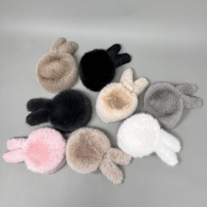 Women’s plush faux fur trapper hat with earflaps and decorative tail Mune Fashion