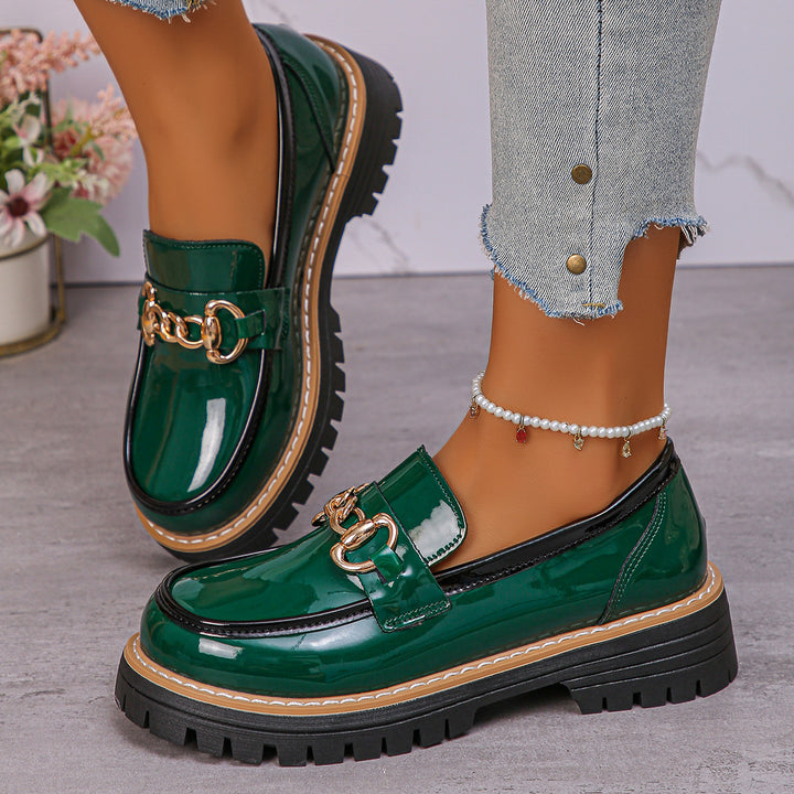 Women's shiny patent loafers with decorative metal buckle and profiled tractor sole Mune Fashion