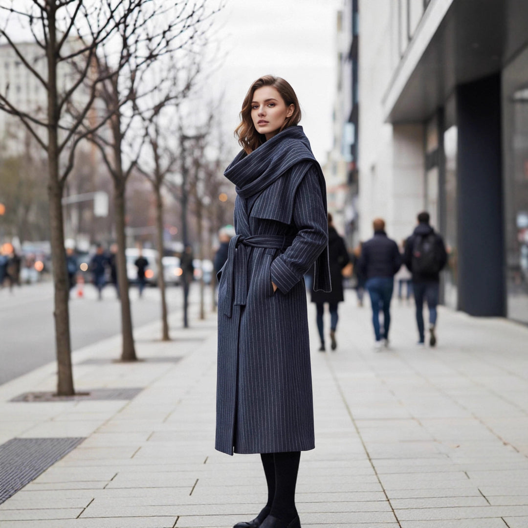Women’s long coat with oversized shawl collar, belt at the waist and pinstripes Mune Fashion