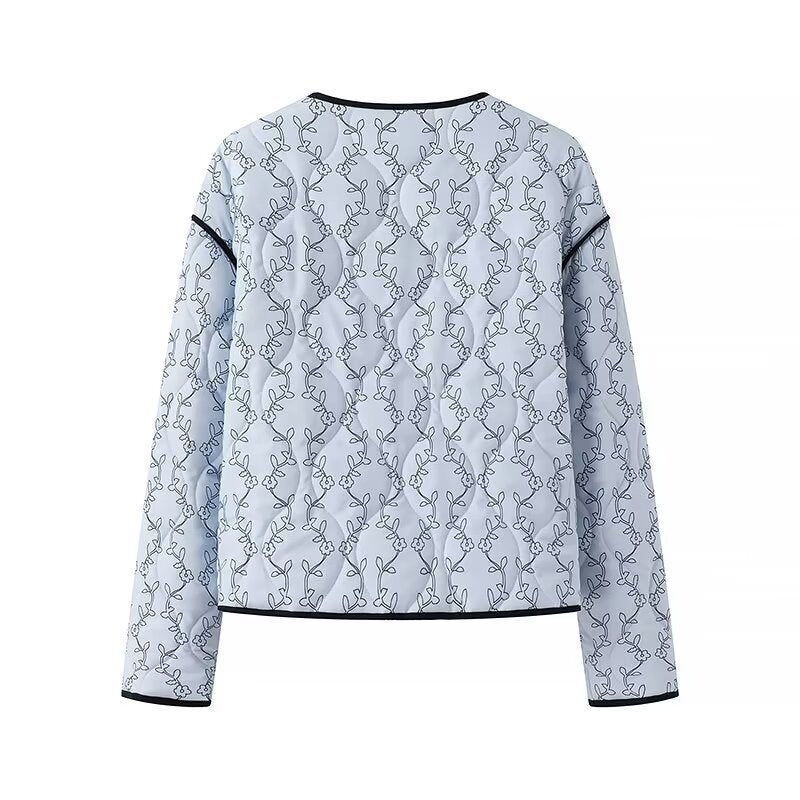 Women's quilted short jacket with V-neck, contrast piping, and floral quilted application Mune Fashion