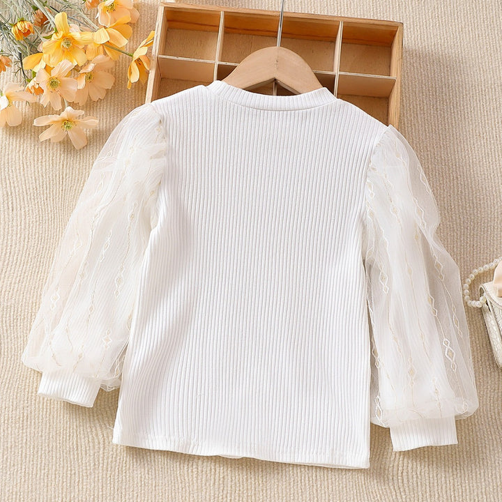 Girls fashionable blouse with transparent puff sleeves and floral accents Mune Fashion