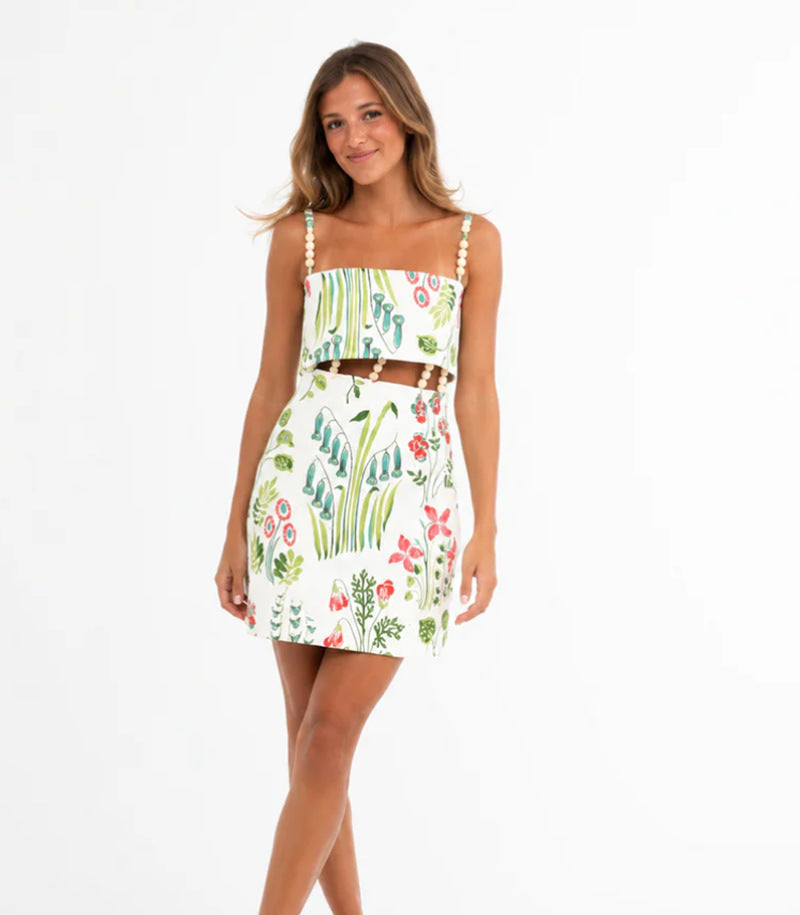 Women's two-piece summer set with pearl straps bandeau top and fitted mini skirt with waist cutout Mune Fashion