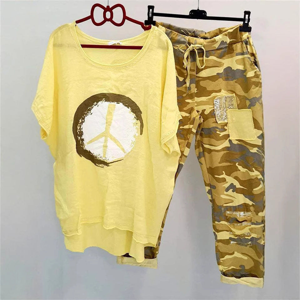 Women’s casual leisure two-piece with wide-cut linen look shirt, peace symbol and camouflage jog pants with patch details Mune Fashion