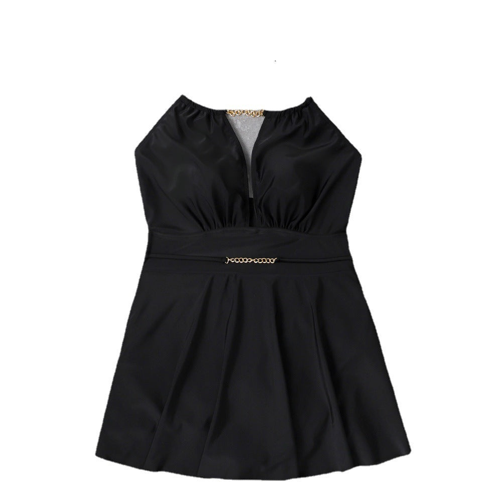 Women's beach dress with deep V-neck and decorative chain detail Mune Fashion