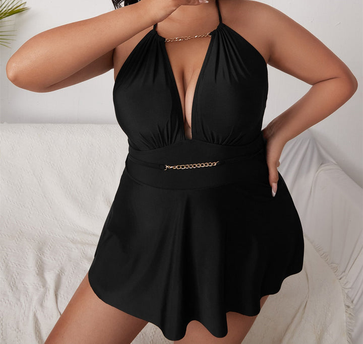 Women's beach dress with deep V-neck and decorative chain detail Mune Fashion