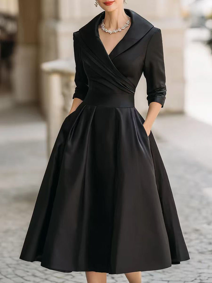 Women's elegant midi dress with wrap top, three-quarter sleeves, and side pockets Mune Fashion