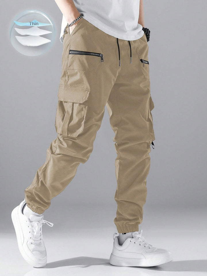Men's slim cargo joggers with multiple zippered pockets, elastic ankle cuff, and drawstring Mune Fashion