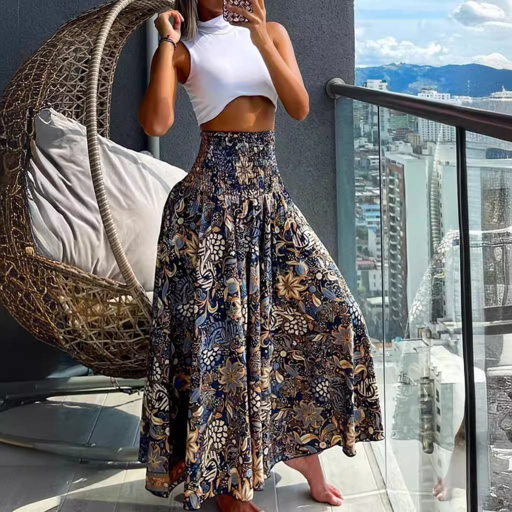 Women's maxi skirt with high smocked waistband, wide fall, and paisley print Mune Fashion