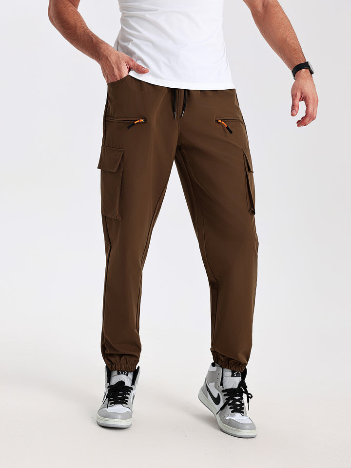 Men's tapered cut utility cargo pants in jogger style with drawstring waistband, zippered pockets & elastic leg cuffs Mune Fashion