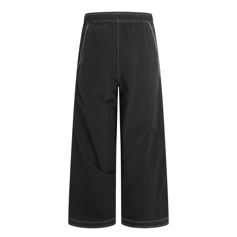 Women's wide pants with elastic waistband, drawstring and contrasting decorative seams Mune Fashion